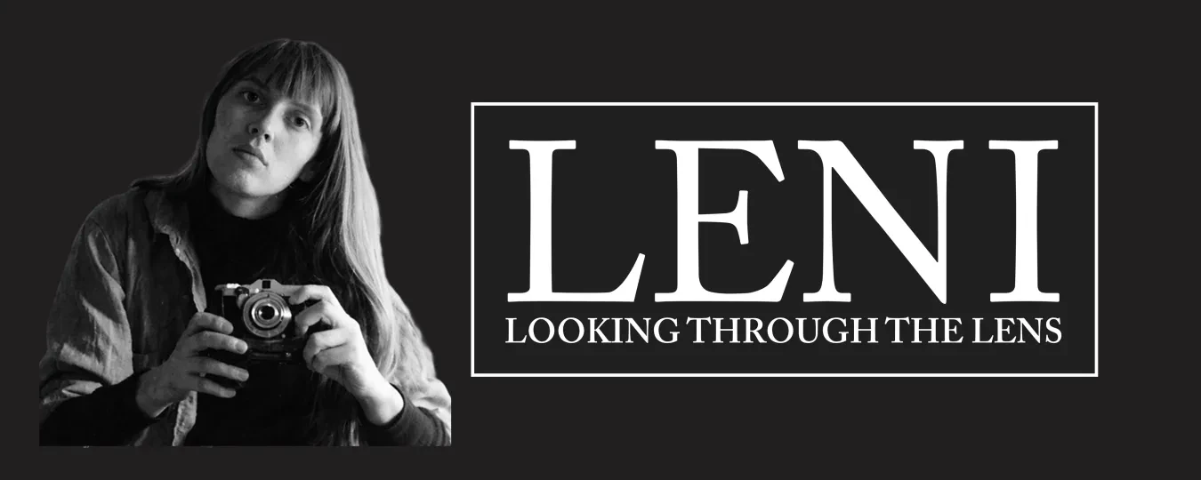 Photograph of a person holding a camera, next to bold text "LENI" on a dark background.