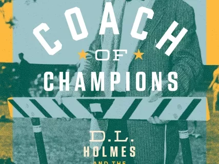 A book cover titled "Coach of Champions" with a vintage photo of a man in a suit and hat holding a stopwatch.