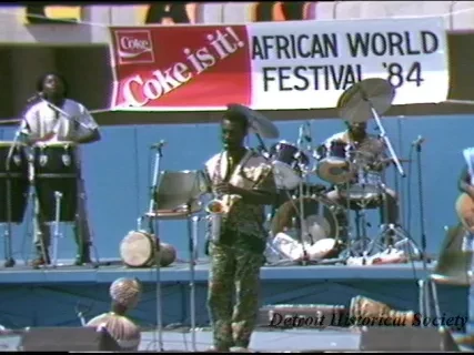 U-Matic - Day: Friday
Date: 8/24/84
Time: 12:30-2:30 P.M.
Subject: African World Festival / 8-24 thru 8-26 (noon 10:00 P.M.)
TV Shots: Band, Pan Shot of Crowd, 2-booths, Assorted Concessions, Artist, Jewelry, etc.