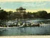 Postcard - The Pavilion on the Lake at Belle Isle Park, showing some happy Canoeists on the lake, Detroit, Mich.