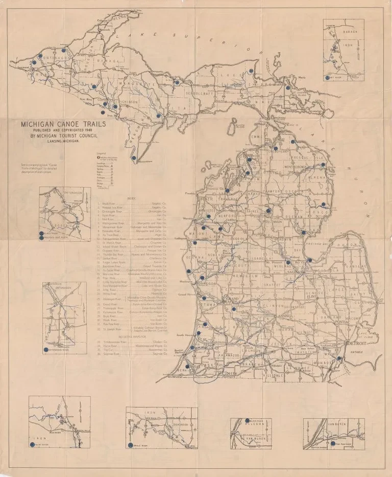 Michigan trails map showing routes and small inset maps of specific areas.